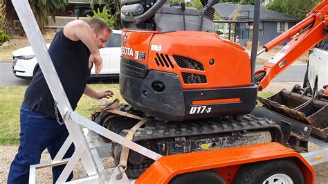 how to strap down a mini excavator on a trailer|adelaide mini excavator strapping instructions.